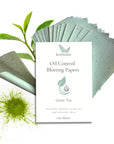 Oil control blotting papers with green tea extract on a white background