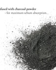 Black charcoal powder with text on a white background