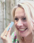Video of a woman using oil control blotting paper